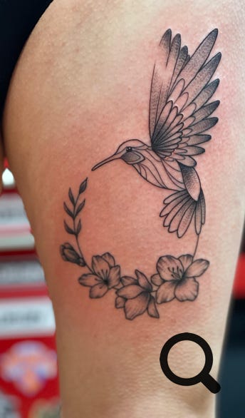 Vogel mit Blumen Tattoo